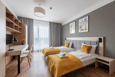 Łóżko lub łóżka w pokoju w obiekcie Aparthotel City Break Wolska