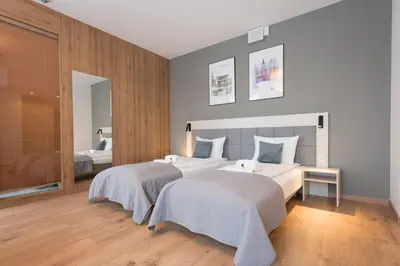 Łóżko lub łóżka w pokoju w obiekcie Aparthotel City Break Wolska