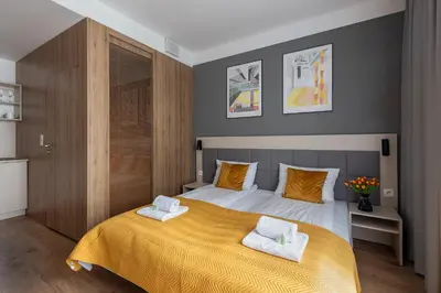 Łóżko lub łóżka w pokoju w obiekcie Aparthotel City Break Wolska
