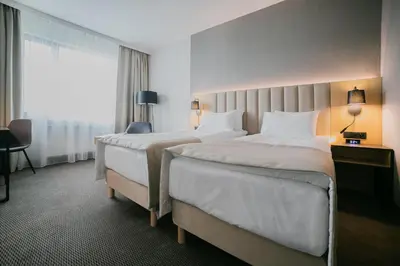 Łóżko lub łóżka w pokoju w obiekcie B&B HOTEL Warsaw East
