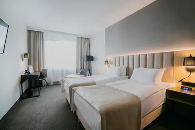 Łóżko lub łóżka w pokoju w obiekcie B&B HOTEL Warsaw East