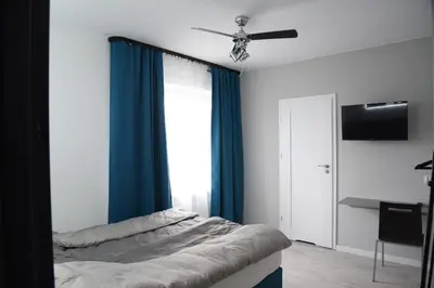 Łóżko lub łóżka w pokoju w obiekcie KOMFORT WILLA