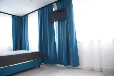 Łóżko lub łóżka w pokoju w obiekcie KOMFORT WILLA