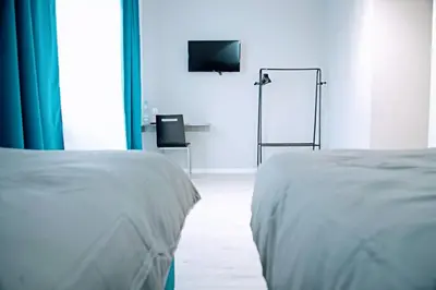 Łóżko lub łóżka w pokoju w obiekcie KOMFORT WILLA
