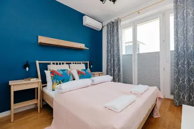 Łóżko lub łóżka w pokoju w obiekcie ShortStayPoland Marszałkowska (B12)