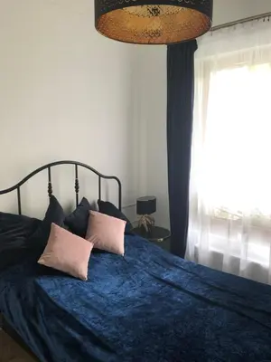 Łóżko lub łóżka w pokoju w obiekcie Mlociny Apartment