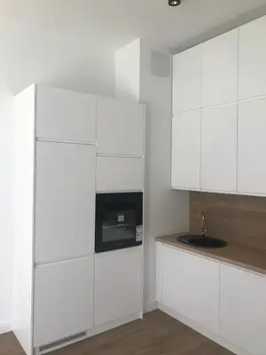 Kuchnia lub aneks kuchenny w obiekcie Mlociny Apartment