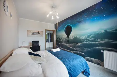 Łóżko lub łóżka w pokoju w obiekcie Cybernetyki 6b Serviced Accommodation