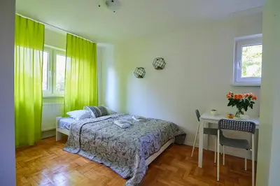 Łóżko lub łóżka w pokoju w obiekcie Regem Apartments Płońska