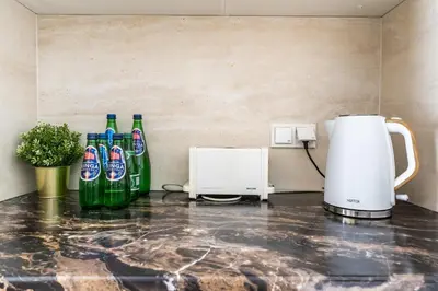 Zestaw do parzenia kawy i herbaty w obiekcie VipWarsawApartments Diamond Mennica Residence