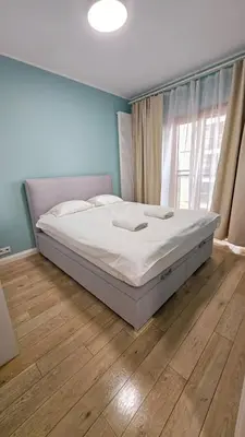 Łóżko lub łóżka w pokoju w obiekcie VipWarsawApartments Diamond Mennica Residence