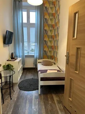 Łóżko lub łóżka w pokoju w obiekcie Deja Vu Hostel