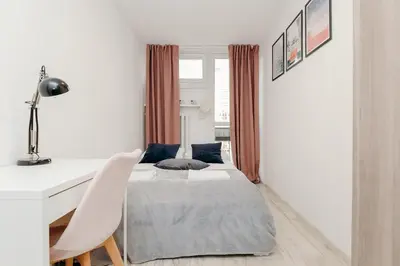 Łóżko lub łóżka w pokoju w obiekcie ShortStayPoland Krochmalna (B17)
