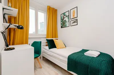 Łóżko lub łóżka w pokoju w obiekcie ShortStayPoland Krochmalna (B17)