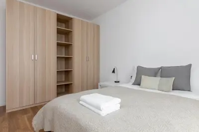 Łóżko lub łóżka w pokoju w obiekcie Royal Wilanów Stylish Apartment by BookingHost