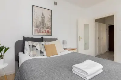 Łóżko lub łóżka w pokoju w obiekcie Park Promenada Cosy Apartment by BookingHost