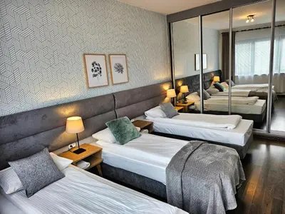 Łóżko lub łóżka w pokoju w obiekcie Apartamenty Arkadia by VisitWarsaw Apartments