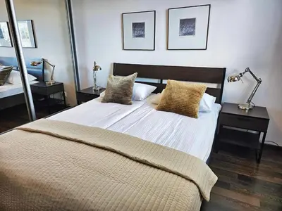 Łóżko lub łóżka w pokoju w obiekcie Apartamenty Arkadia by VisitWarsaw Apartments
