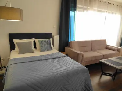 Łóżko lub łóżka w pokoju w obiekcie Apartamenty Arkadia by VisitWarsaw Apartments