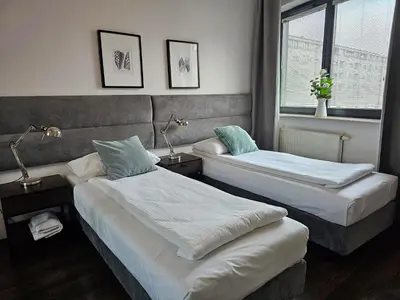Łóżko lub łóżka w pokoju w obiekcie Apartamenty Arkadia by VisitWarsaw Apartments