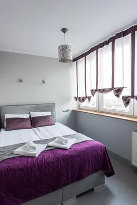Łóżko lub łóżka w pokoju w obiekcie Magnetic apartment Jerozolimskie A