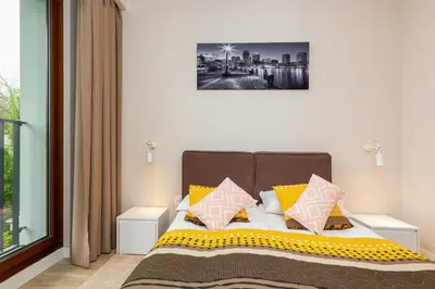 Łóżko lub łóżka w pokoju w obiekcie Apartments Warsaw Magazynowa by Noclegi Renters