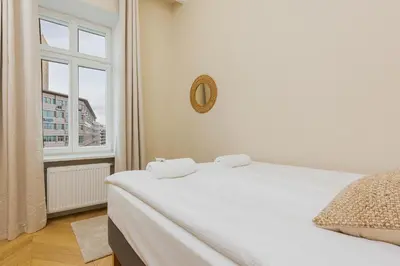 Łóżko lub łóżka w pokoju w obiekcie Apartments Warsaw Targowa by Noclegi Renters