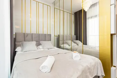 Łóżko lub łóżka w pokoju w obiekcie Browary Warszawskie City Center by Renters Prestige