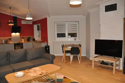 Telewizja i/lub zestaw kina domowego w obiekcie Cichy Zakątek - ekskluzywny apartament 90 m2