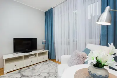 Telewizja i/lub zestaw kina domowego w obiekcie Apartment Warsaw Kredytowa by Noclegi Renters