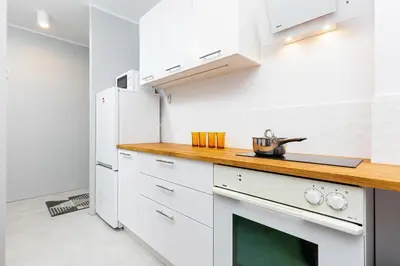 Kuchnia lub aneks kuchenny w obiekcie Apartment Warsaw Kredytowa by Noclegi Renters