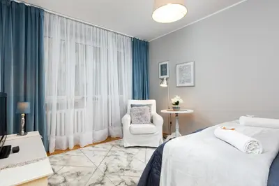 Łóżko lub łóżka w pokoju w obiekcie Apartment Warsaw Kredytowa by Noclegi Renters