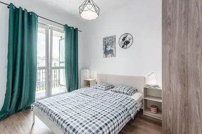 Łóżko lub łóżka w pokoju w obiekcie Chill Apartments Ursynów Premium