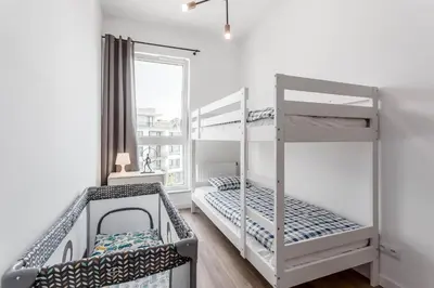 Łóżko lub łóżka w pokoju w obiekcie Chill Apartments Ursynów Premium