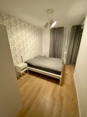 Łóżko lub łóżka w pokoju w obiekcie Panoramic view apartments Warsaw West II