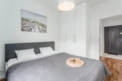 Łóżko lub łóżka w pokoju w obiekcie Chill Apartments Airport Residence