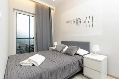 Łóżko lub łóżka w pokoju w obiekcie Apartments Warsaw Wola Business Center by Noclegi Renters
