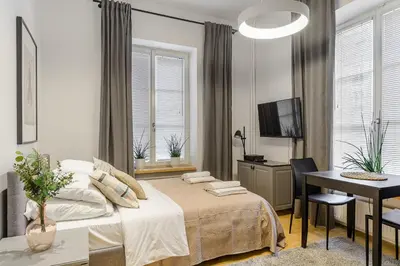 Łóżko lub łóżka w pokoju w obiekcie P&O Apartments Warecka Street