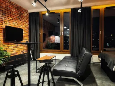 Telewizja i/lub zestaw kina domowego w obiekcie Loft Apartment Browary Warszawskie