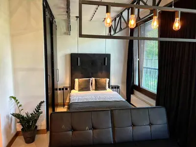 Łóżko lub łóżka w pokoju w obiekcie Loft Apartment Browary Warszawskie