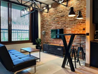 Telewizja i/lub zestaw kina domowego w obiekcie Loft Apartment Browary Warszawskie