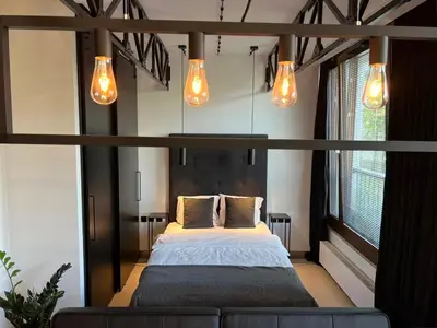 Łóżko lub łóżka w pokoju w obiekcie Loft Apartment Browary Warszawskie