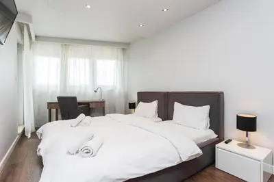 Łóżko lub łóżka w pokoju w obiekcie Oxygen Residence