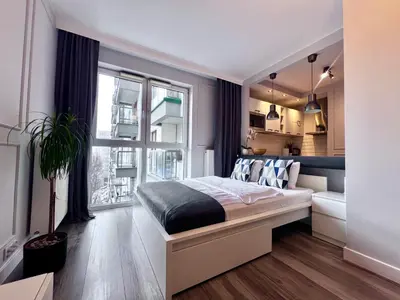 Łóżko lub łóżka w pokoju w obiekcie Airport Apartment Warszawa