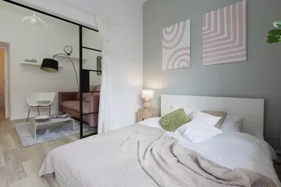 Łóżko lub łóżka w pokoju w obiekcie Warsaw Concierge Stalowa