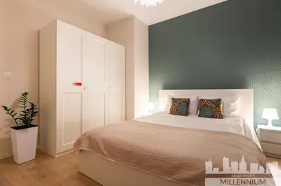 Łóżko lub łóżka w pokoju w obiekcie JM Millennium Port