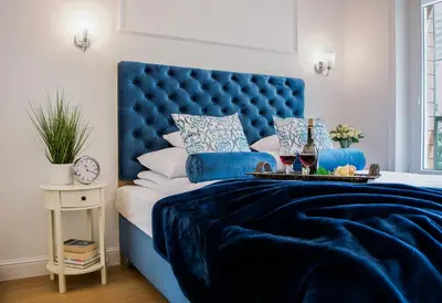 Łóżko lub łóżka w pokoju w obiekcie Warsaw Seasons by Alluxe Boutique Apartments