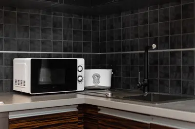Kuchnia lub aneks kuchenny w obiekcie Wilcza 26A by Homeprime