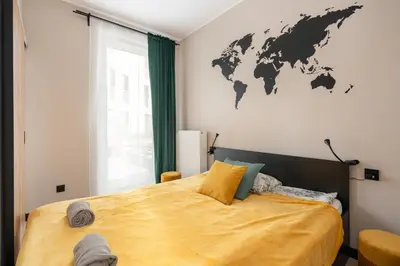 Łóżko lub łóżka w pokoju w obiekcie SuperApart Aignera apt 4, Family Friendly Oasis