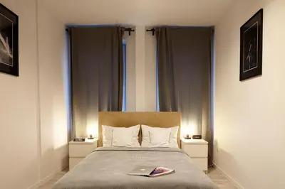 Łóżko lub łóżka w pokoju w obiekcie oompH Warsaw Central Premium Apartments